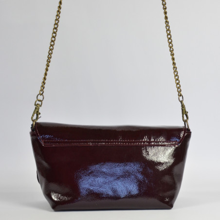 Sous Les Pavés Baguette Maï Taï bag in prune varnished leather