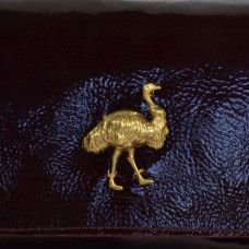 Sous Les Pavés Baguette Maï Taï bag in prune varnished leather